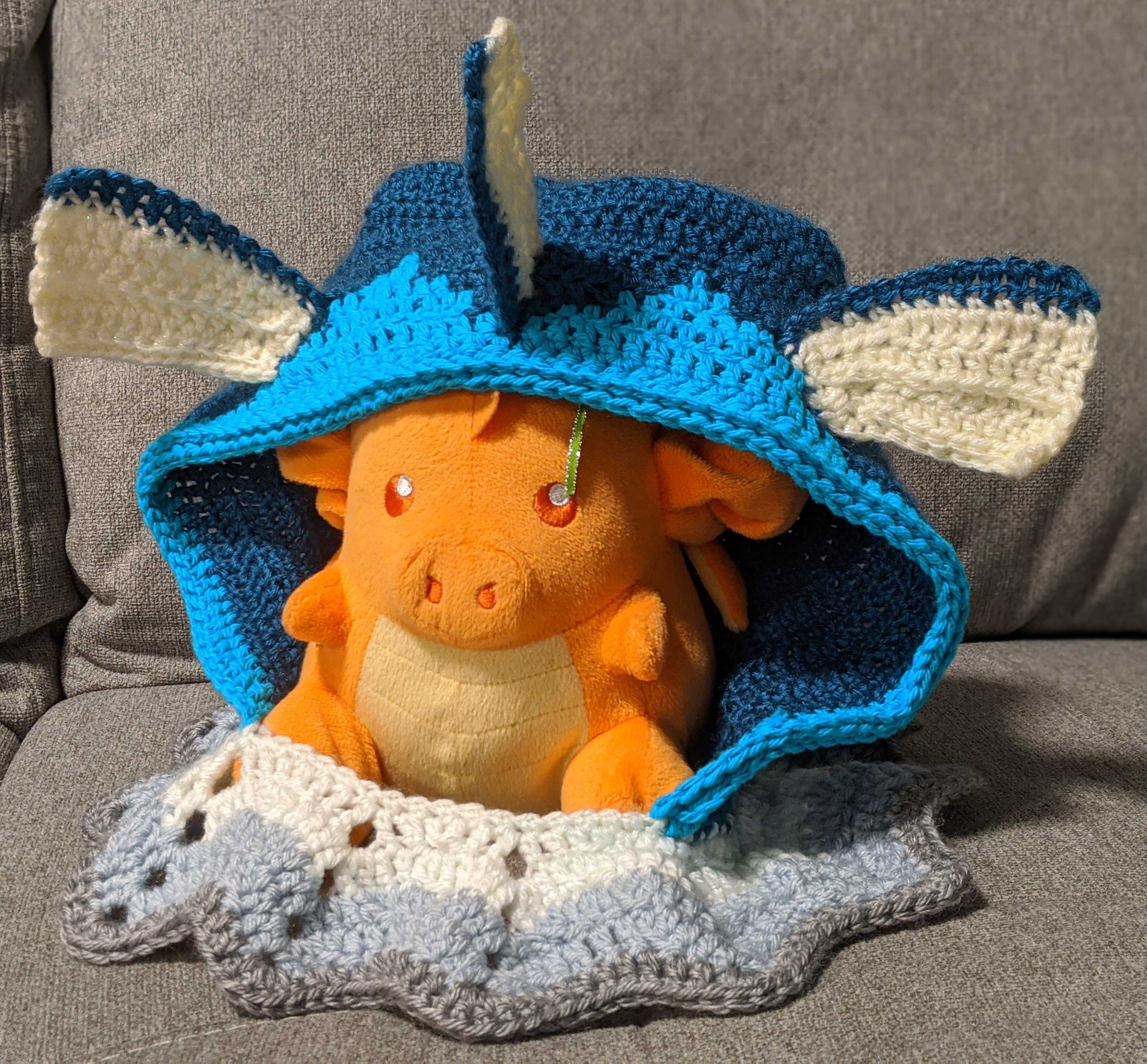 I made this for a craft exchange. I modified a hooded pattern and free-handed the fins.